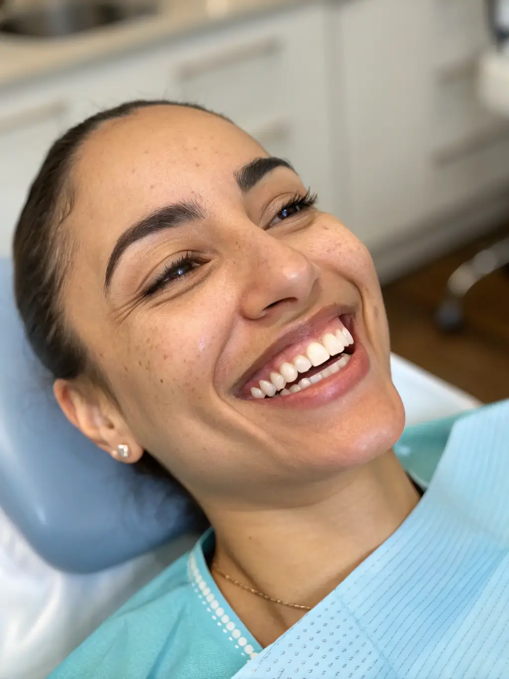 A patient happily showcasing their smile after receiving teeth whitening treatment at LetsDentalSmile, highlighting the immediate brightening effect and enhanced confidence.